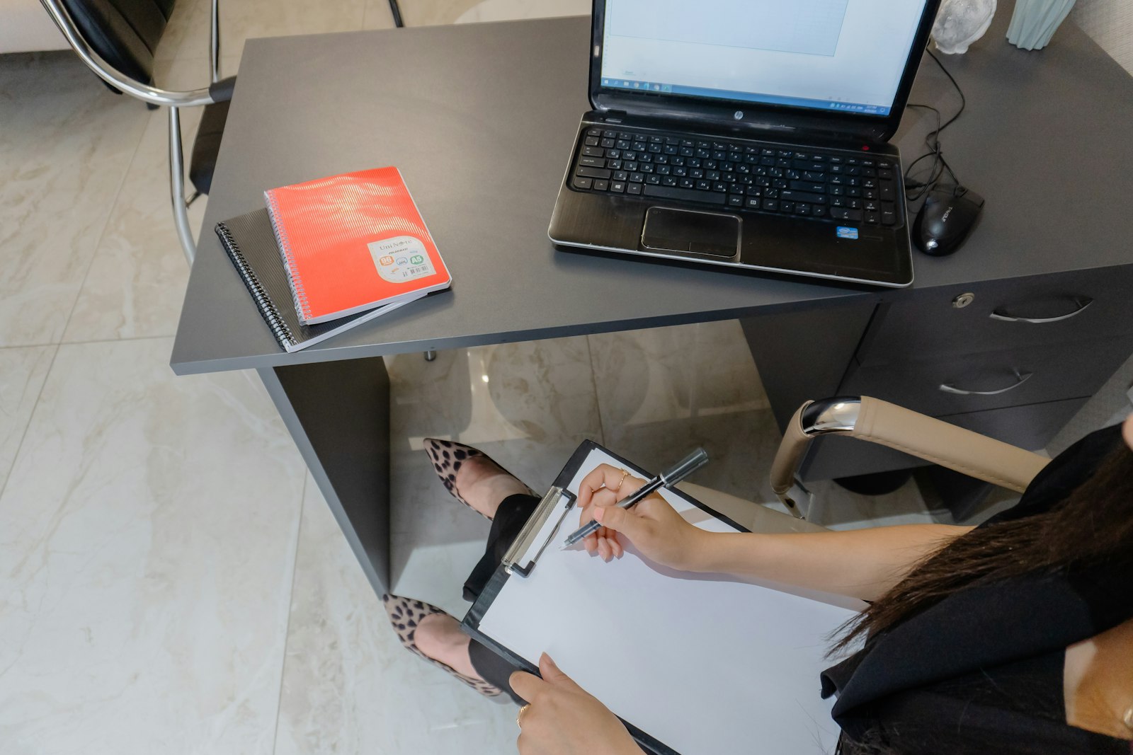 a person reviewing paperwork at a desk after a settlement issue