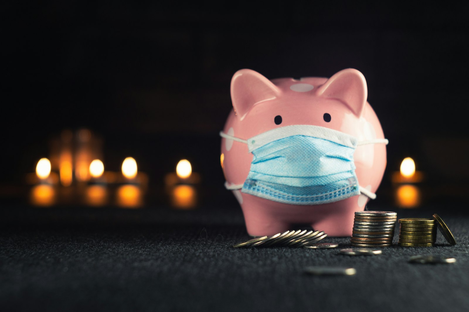 a pink and blue pig figurine representing savings