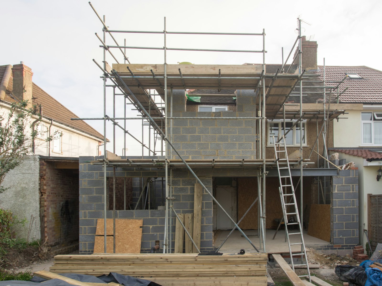 a newly built brick house under a clear sky