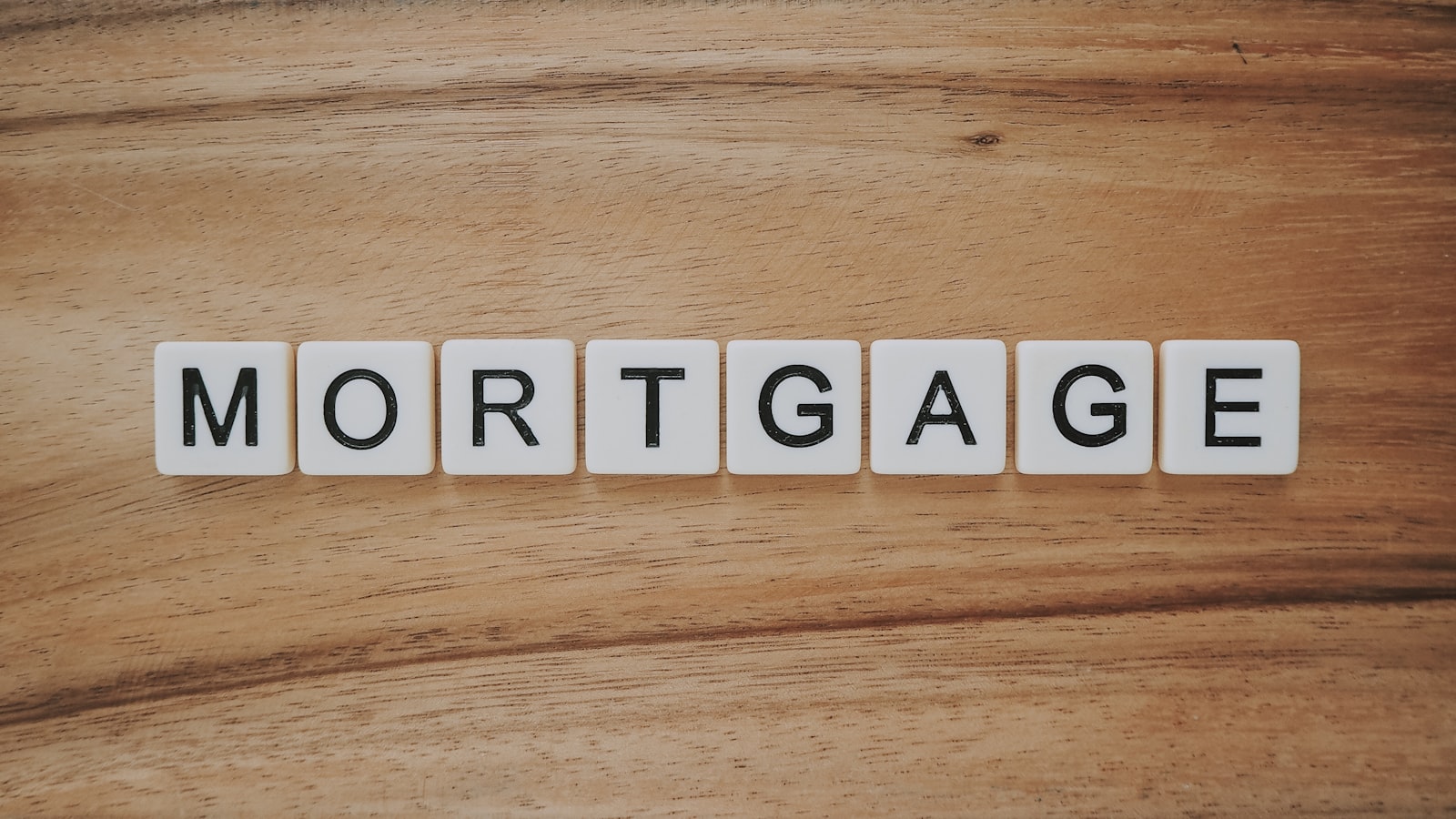 wooden tiles spelling the word mortgage
