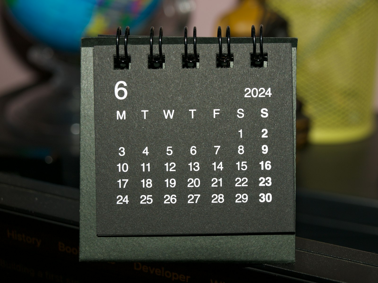 a calendar on a table used to track a settlement timeline