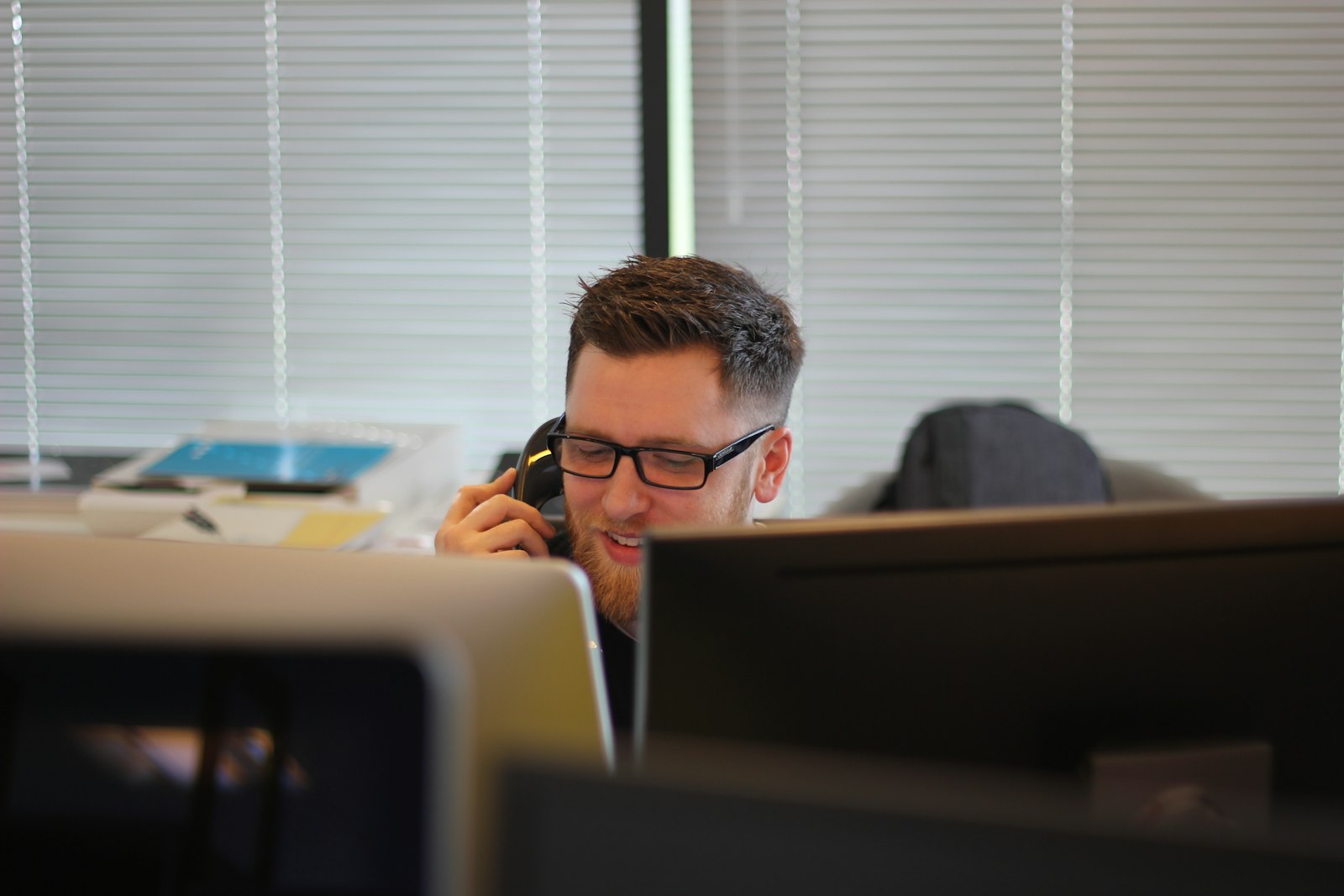 a man using an ip phone inside a room