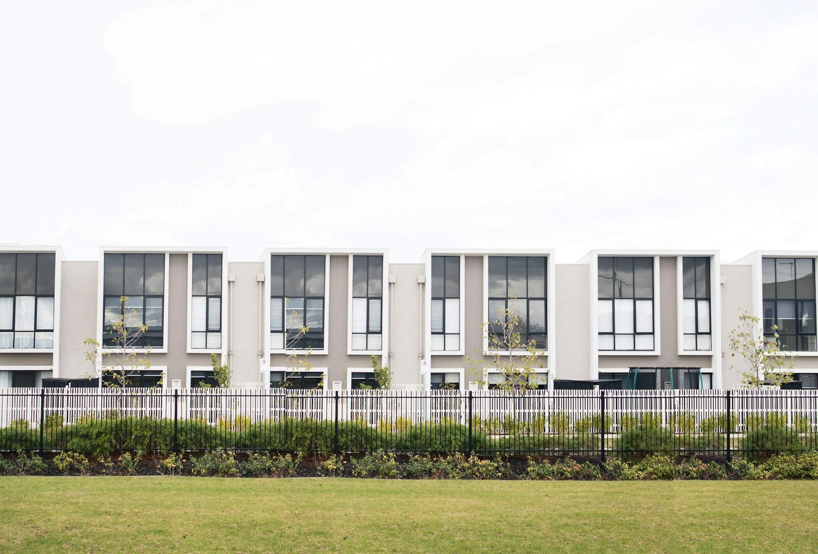 white concrete apartment building during daytime
