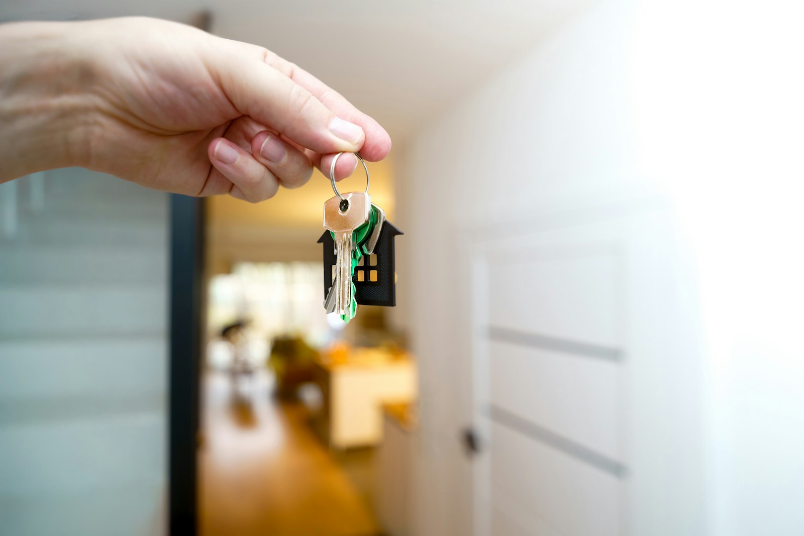 couple holding house keys together